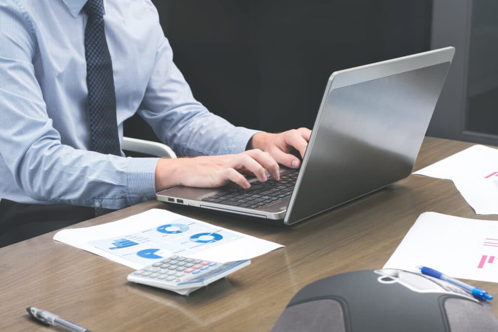 office-staff-typing-on-laptop