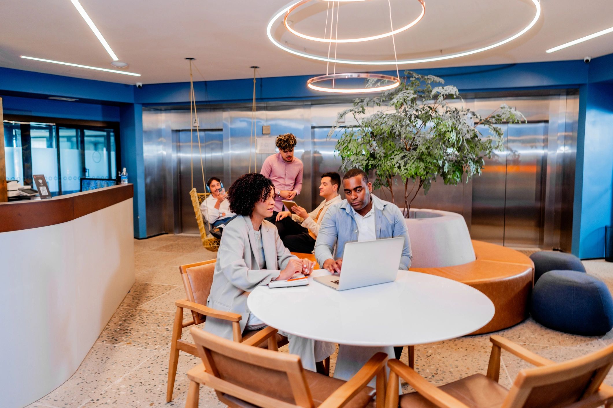 IT professionals meeting with a client in an office