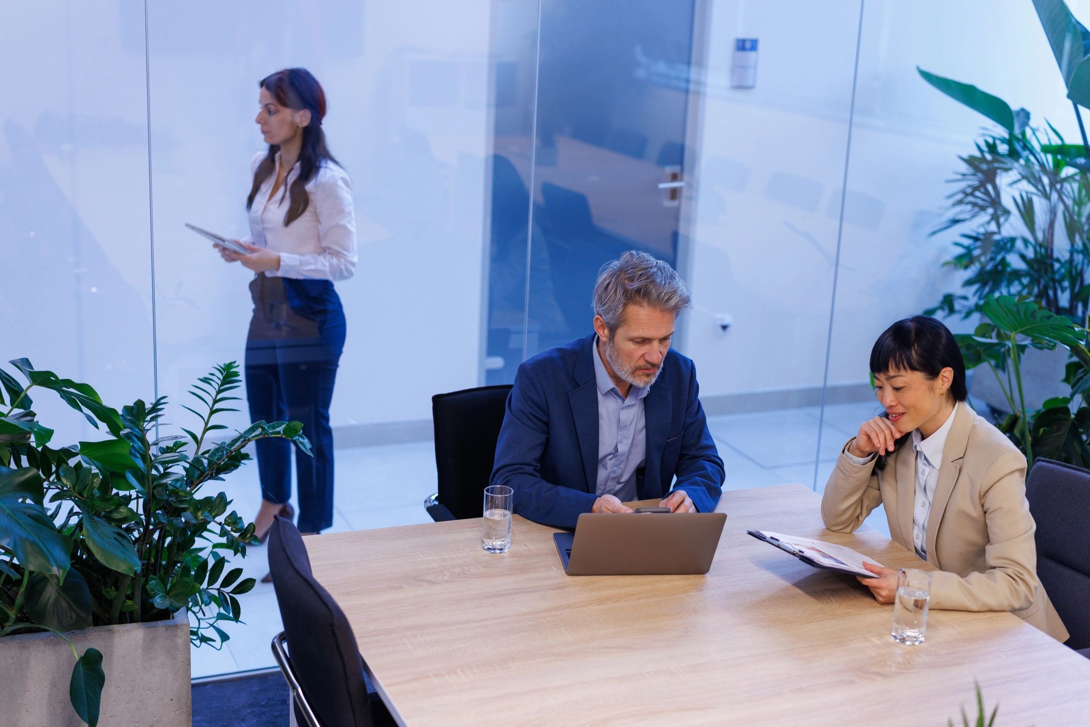 Diverse business professionals collaborating in a modern office environment