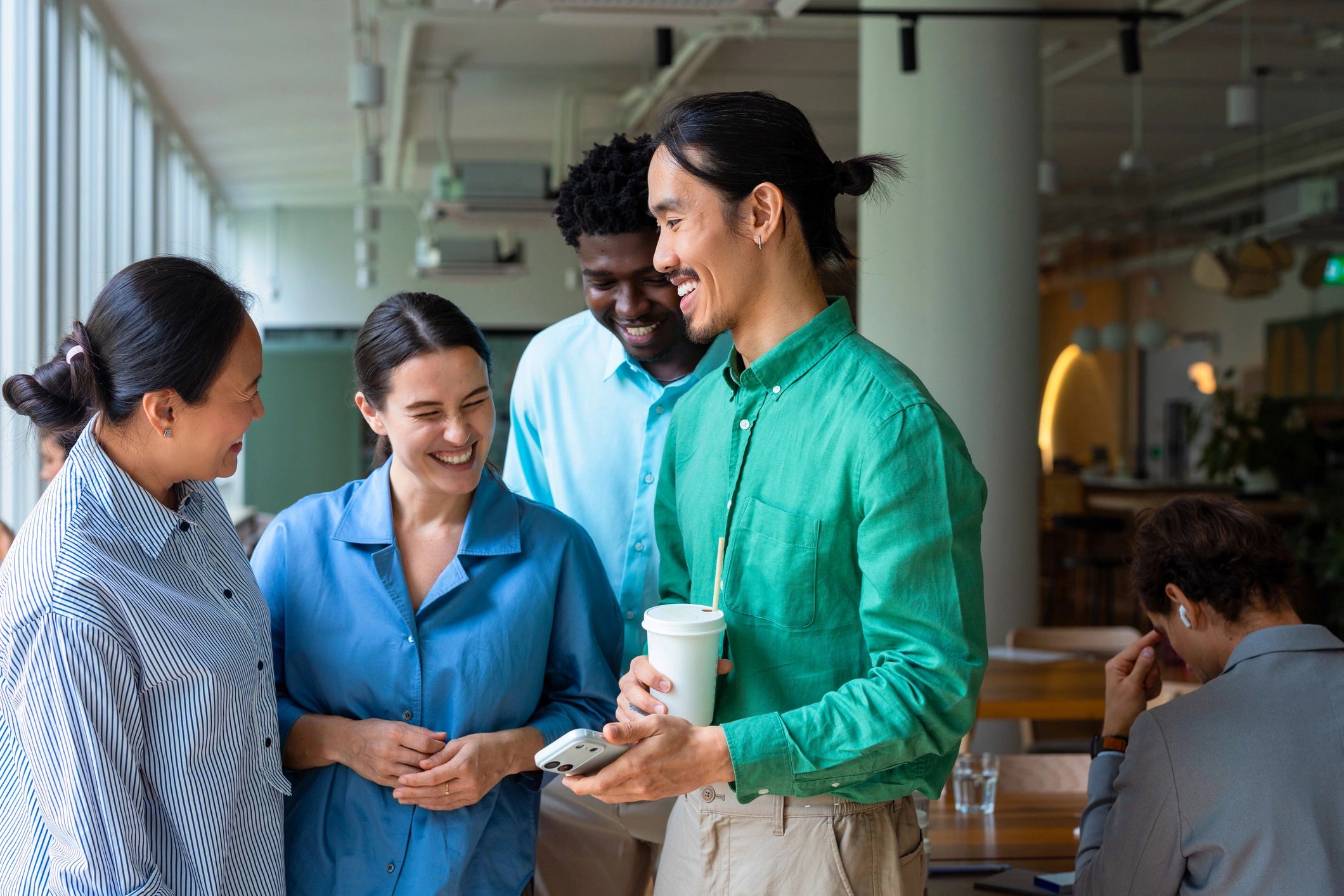 Coworkers collaborating in a bright modern office